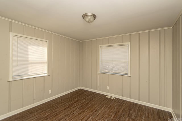 spare room featuring dark hardwood / wood-style floors