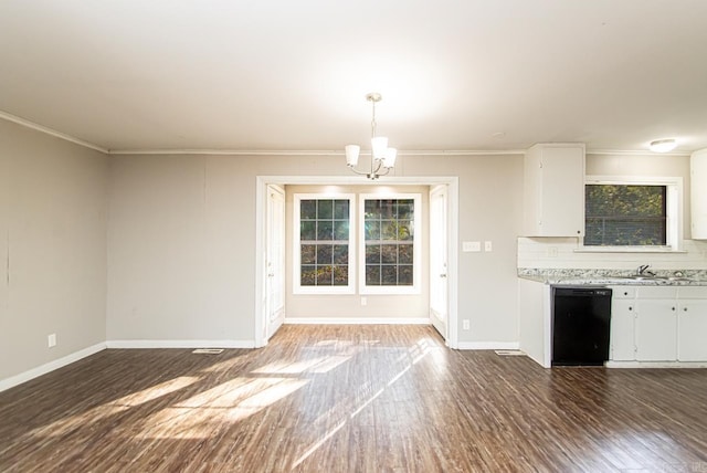 kitchen featuring crown molding, dishwasher, a notable chandelier, white cabinets, and hanging light fixtures