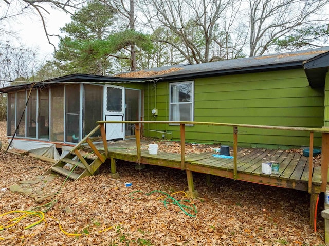 back of house with a deck and a sunroom