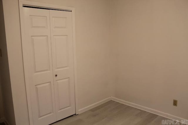 interior space with light hardwood / wood-style flooring and a closet