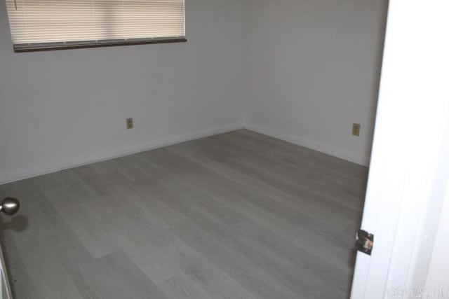 empty room featuring hardwood / wood-style floors