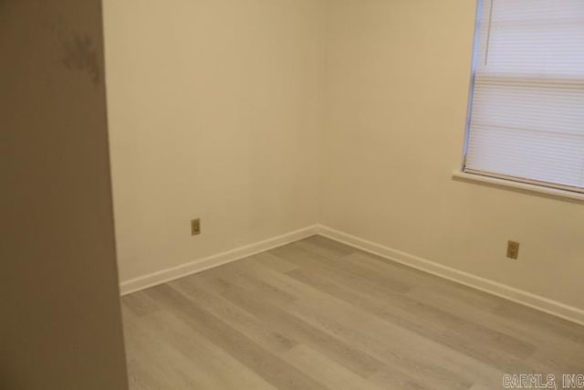 spare room featuring light hardwood / wood-style floors