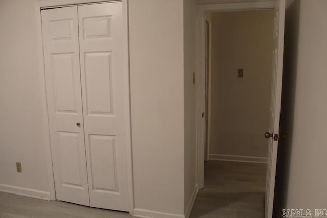 corridor with light wood-type flooring