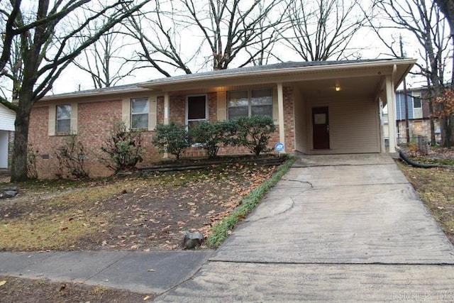 single story home featuring a carport