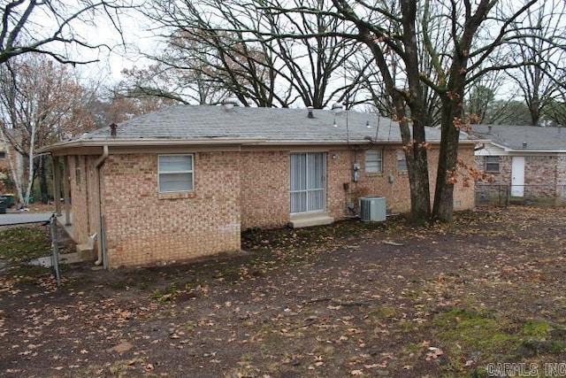 rear view of property with central air condition unit