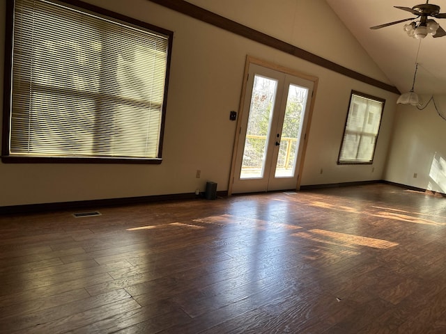 spare room featuring ceiling fan, french doors, dark wood-type flooring, and lofted ceiling