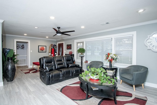 living room with ceiling fan, light hardwood / wood-style floors, and crown molding