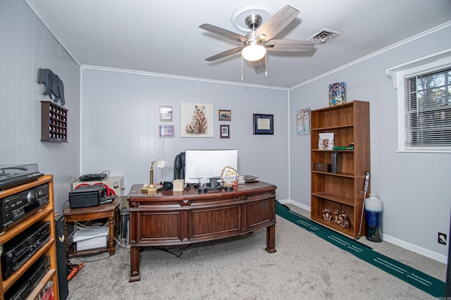 carpeted home office with ceiling fan and ornamental molding