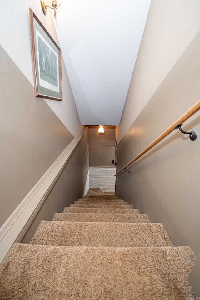 stairs with lofted ceiling