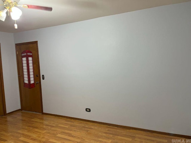 spare room featuring light hardwood / wood-style floors and ceiling fan