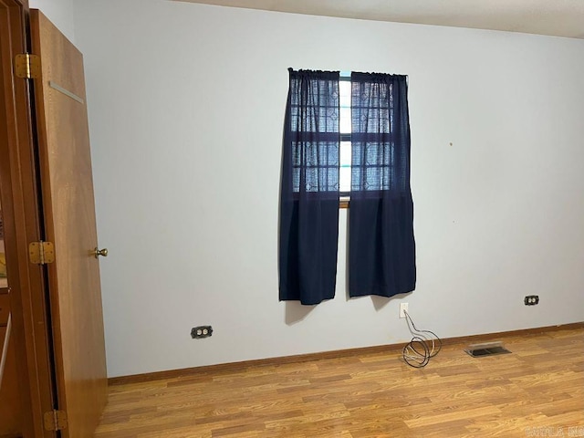 empty room with light hardwood / wood-style floors