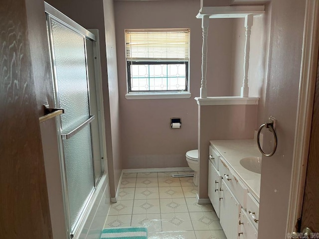 full bathroom featuring vanity, toilet, and combined bath / shower with glass door