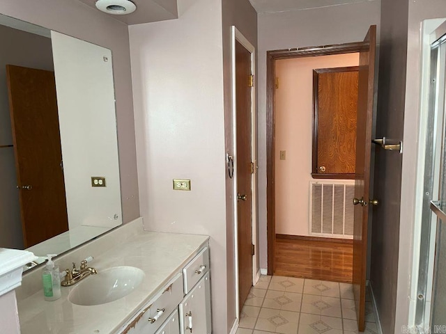 bathroom with tile patterned flooring and vanity