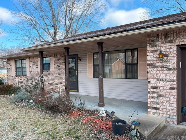 single story home featuring a porch