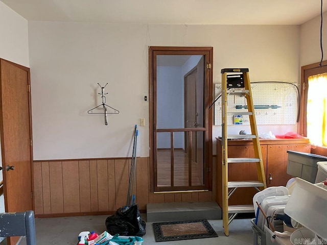 workout area featuring wooden walls