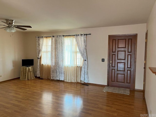 foyer entrance with ceiling fan and hardwood / wood-style floors