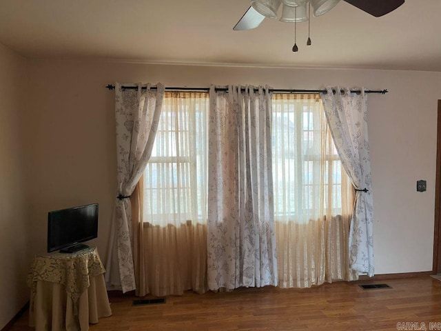 interior space featuring hardwood / wood-style floors and ceiling fan