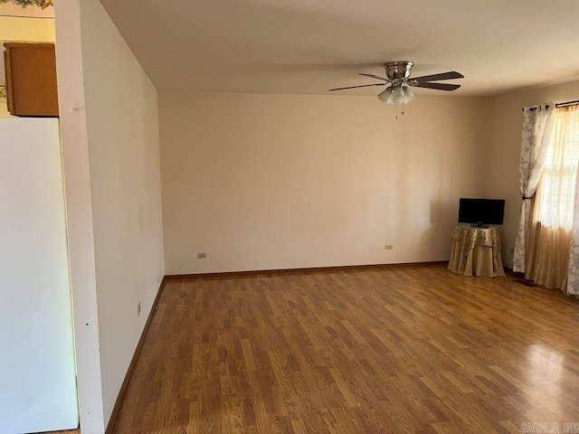 interior space featuring wood-type flooring and ceiling fan