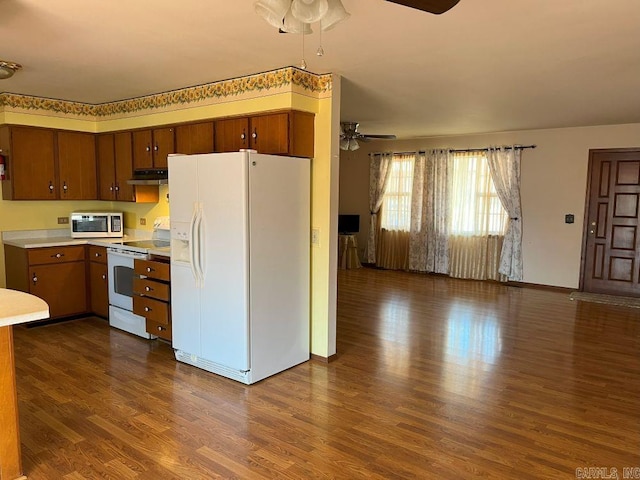 kitchen with ceiling fan, dark hardwood / wood-style floors, and white appliances