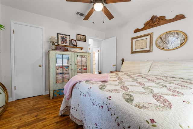 bedroom featuring ceiling fan and hardwood / wood-style flooring