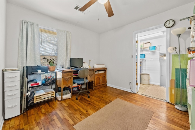 office space featuring ceiling fan and hardwood / wood-style flooring