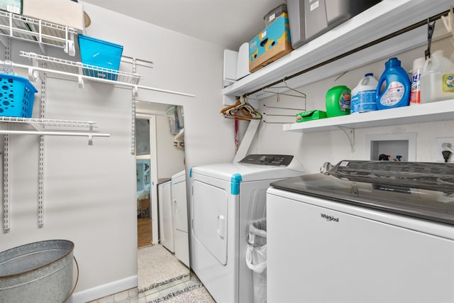 laundry area with independent washer and dryer