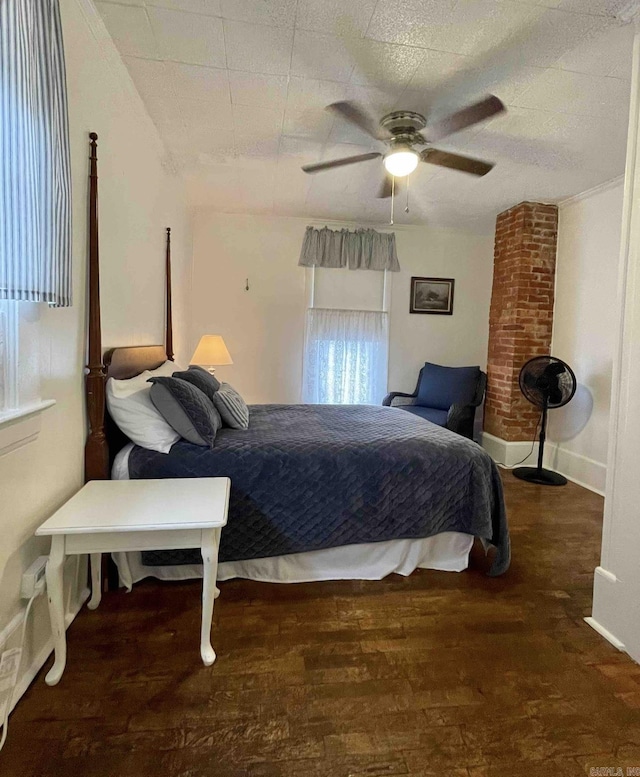 bedroom featuring multiple windows, ceiling fan, and dark wood-type flooring