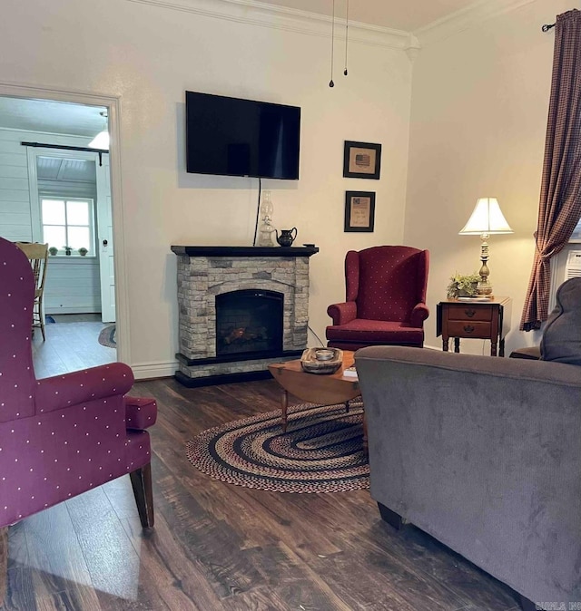 living room with a fireplace, crown molding, and dark wood-type flooring