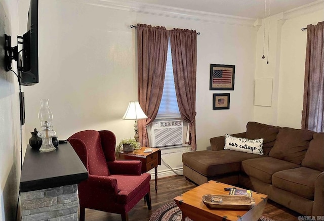 living room with wood-type flooring, a baseboard radiator, cooling unit, and crown molding