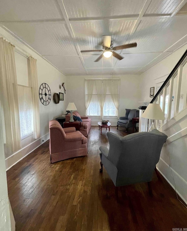 living room with ceiling fan and dark wood-type flooring