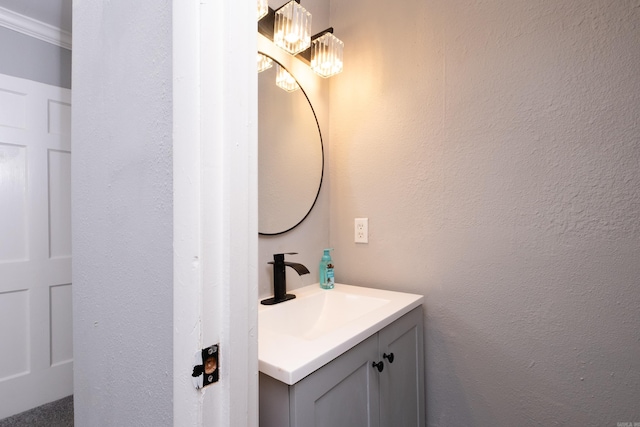 bathroom featuring vanity and crown molding