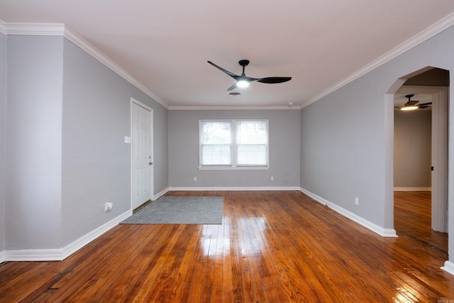 unfurnished room featuring hardwood / wood-style flooring, ceiling fan, and ornamental molding