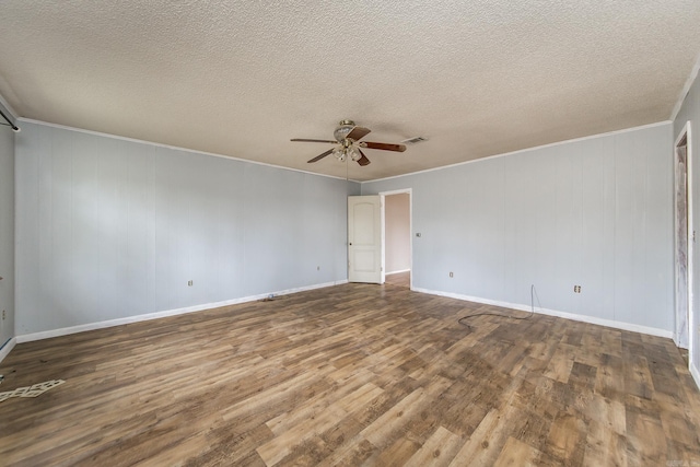 unfurnished room featuring ceiling fan, wood-type flooring, and a textured ceiling