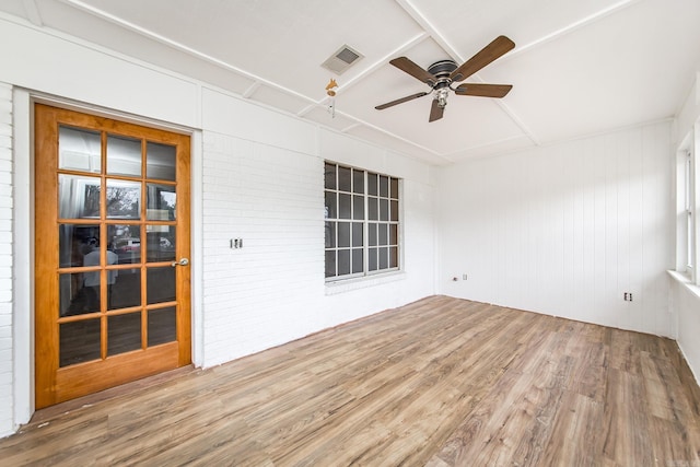 interior space with ceiling fan