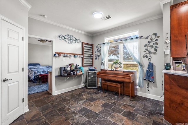 misc room featuring wine cooler and ornamental molding