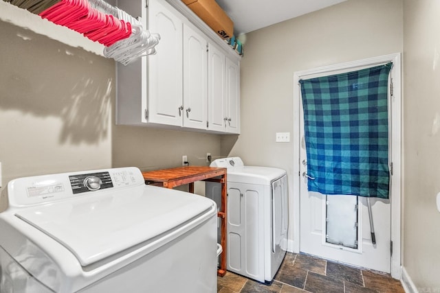 laundry area featuring cabinets and washing machine and dryer