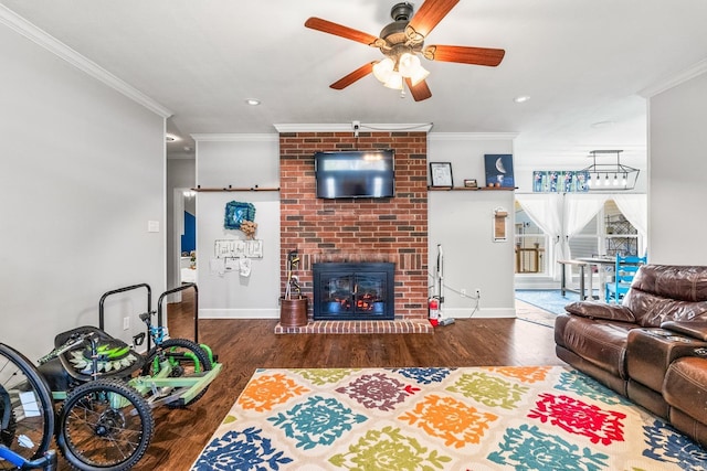 living room with dark hardwood / wood-style flooring and crown molding