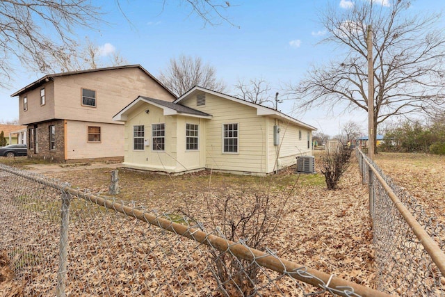 rear view of house with cooling unit