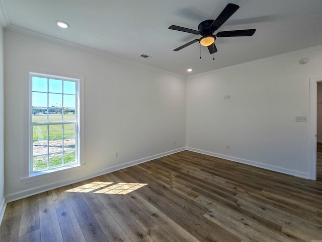 spare room featuring ceiling fan, dark hardwood / wood-style floors, and ornamental molding