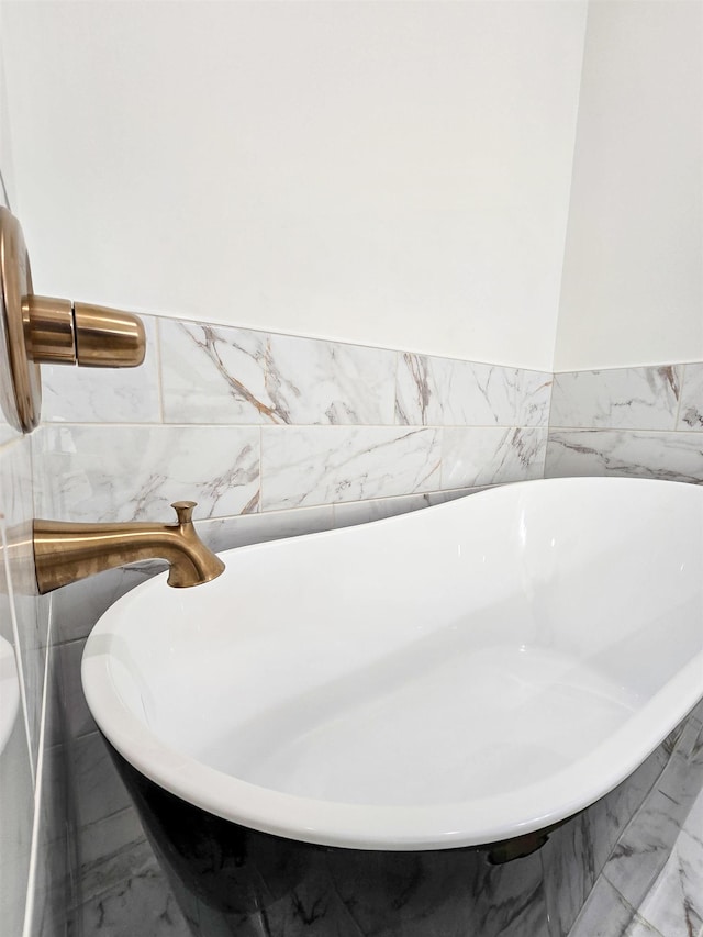 bathroom with tiled bath