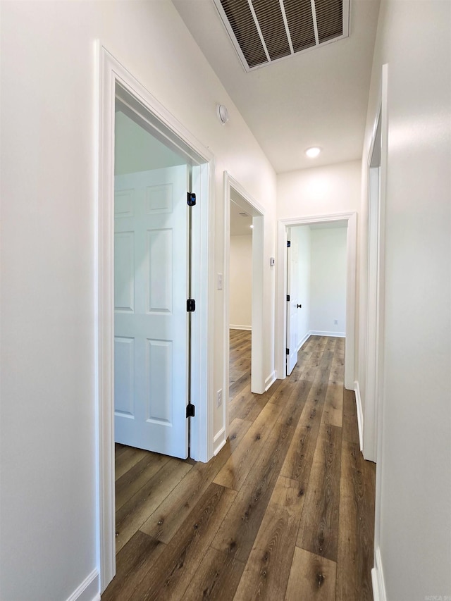 hallway featuring dark hardwood / wood-style floors