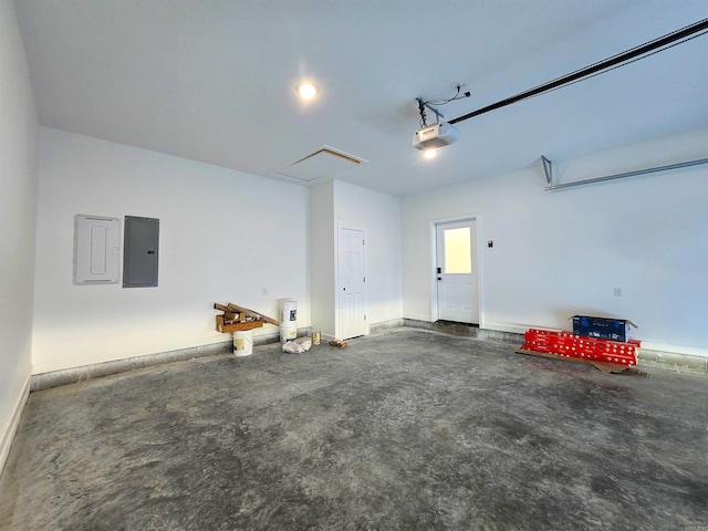 garage featuring electric panel and a garage door opener