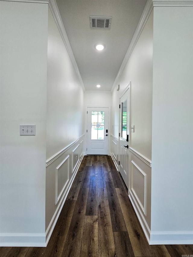 entryway with crown molding and dark hardwood / wood-style floors