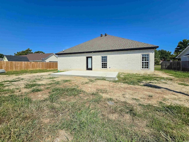 rear view of house with a patio