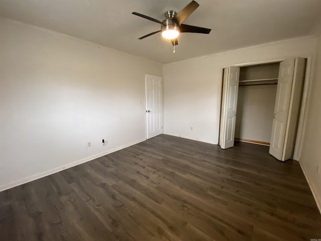 unfurnished bedroom with a closet, ceiling fan, and dark hardwood / wood-style flooring