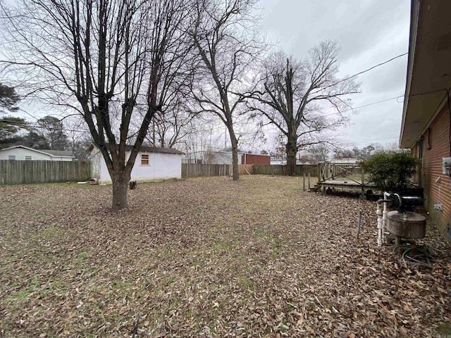 view of yard with a wooden deck