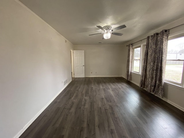 spare room featuring ceiling fan and dark wood-type flooring