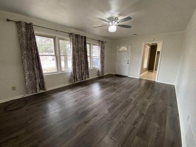 empty room featuring dark hardwood / wood-style floors and ceiling fan