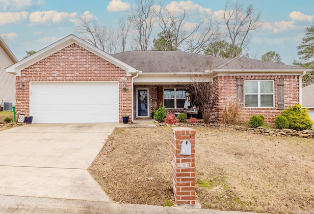 ranch-style house featuring a porch, central AC, and a garage