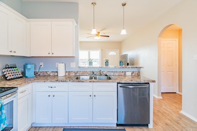 kitchen with white cabinets, stainless steel appliances, ceiling fan, and sink